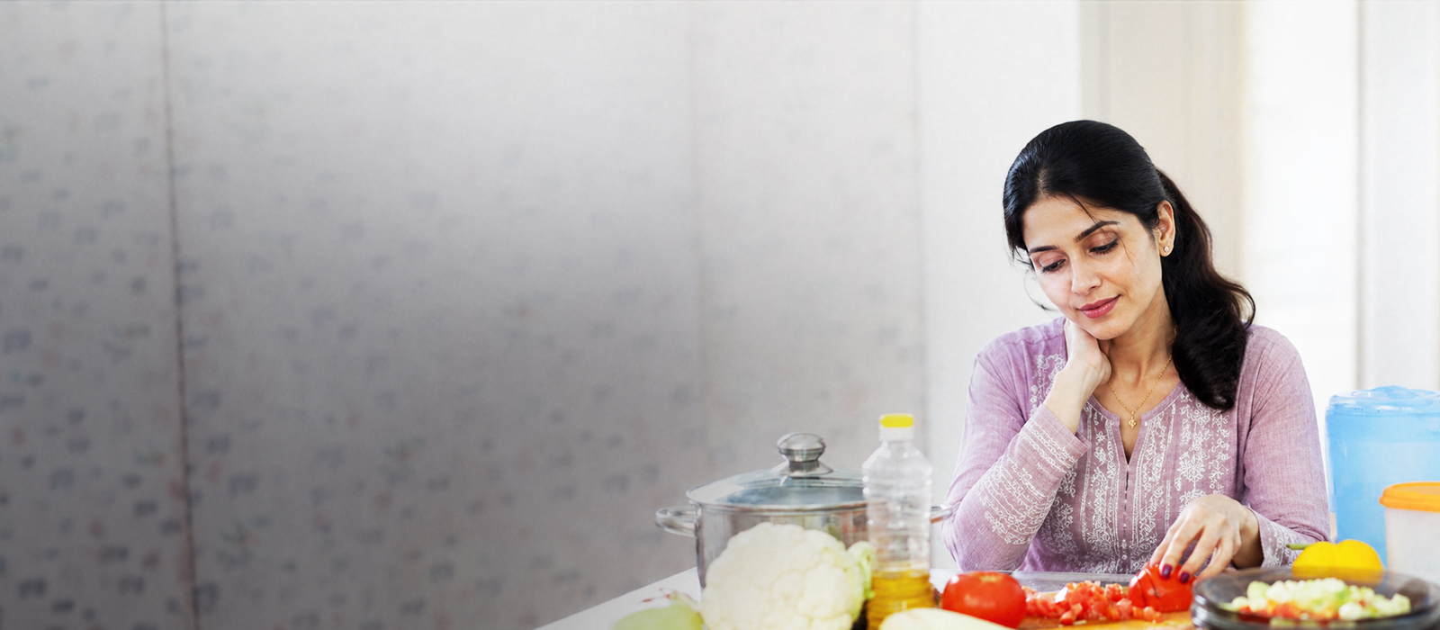 Woman smiling with hands on stomach, feeling comfortable after a healthy meal