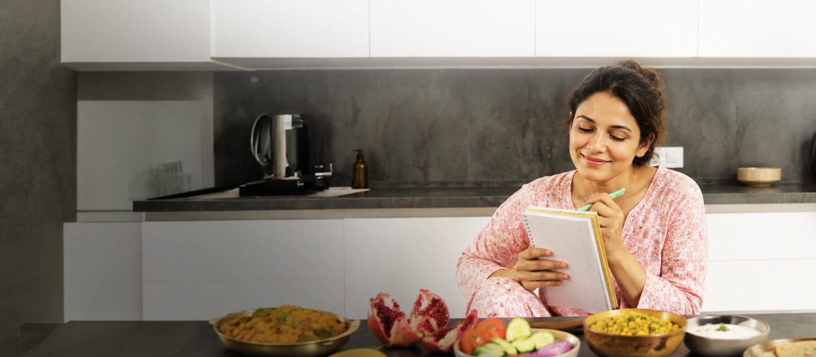 Woman smiling with hands on stomach, feeling comfortable after a healthy meal